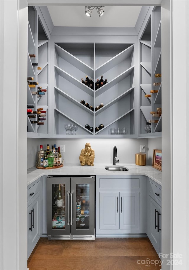 pantry featuring sink and wine cooler