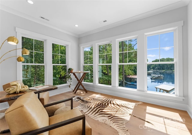 sunroom with a water view