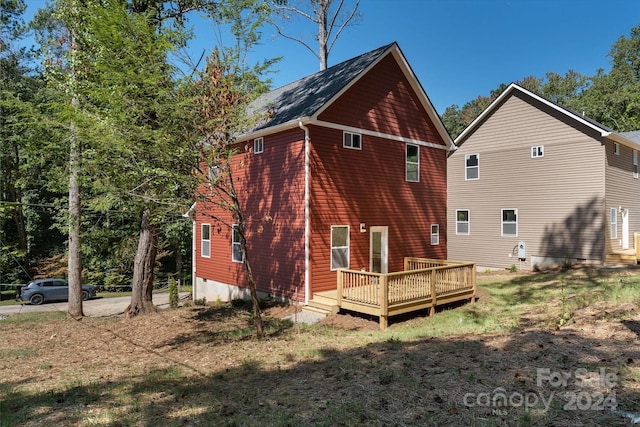 back of property featuring a deck