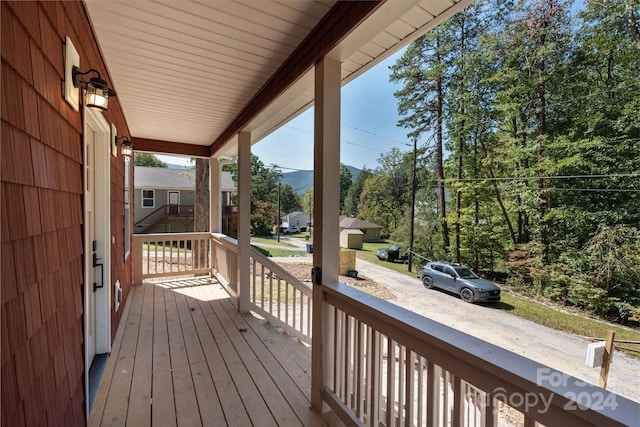 wooden terrace featuring a porch