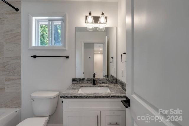 full bathroom featuring toilet, vanity, and tiled shower / bath combo