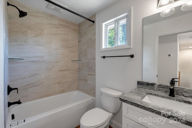 full bathroom featuring vanity, toilet, and tiled shower / bath combo