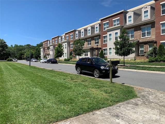 view of community featuring a yard