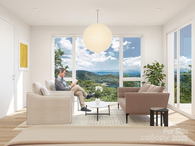 interior space featuring recessed lighting, a wealth of natural light, and light wood-type flooring