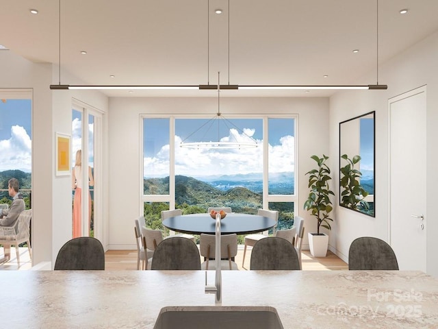 dining area featuring recessed lighting, a chandelier, and a wealth of natural light