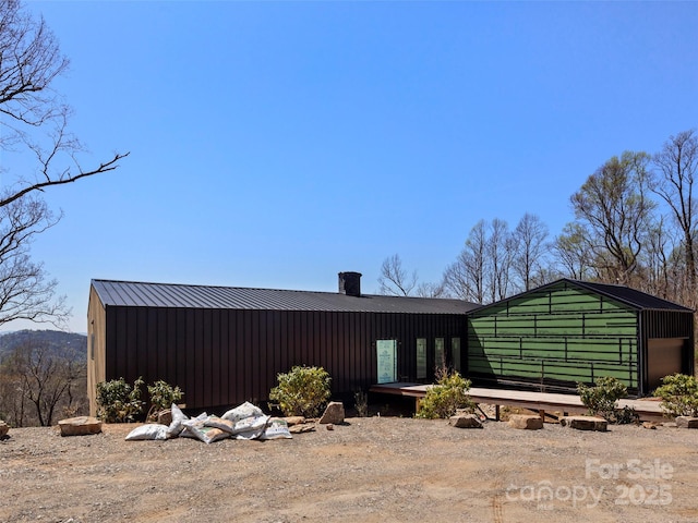 back of property featuring a chimney