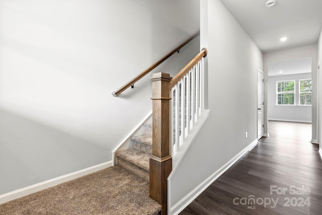 stairway featuring hardwood / wood-style flooring