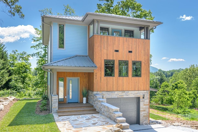 modern home featuring a garage