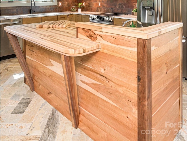 interior space featuring sink and stainless steel appliances