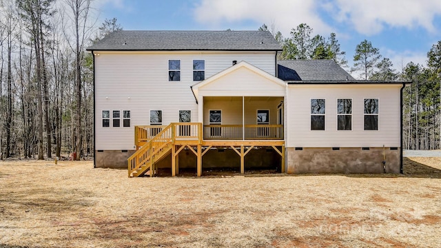 rear view of house featuring a deck