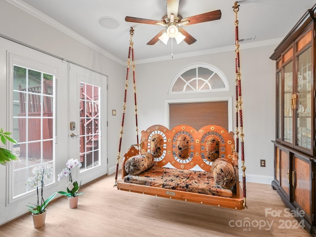 interior space with ceiling fan, light hardwood / wood-style flooring, ornamental molding, and french doors