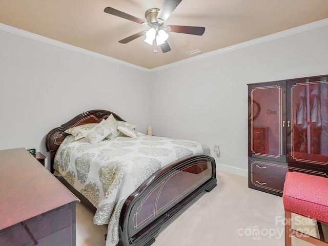 bedroom featuring ceiling fan, light colored carpet, and crown molding