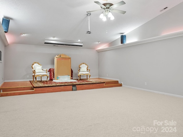 interior space with carpet floors, ceiling fan, and vaulted ceiling