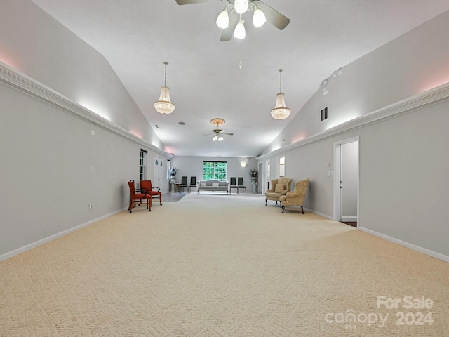 unfurnished room featuring vaulted ceiling, ceiling fan, and carpet floors