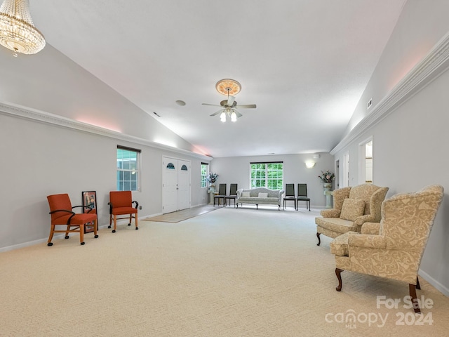 interior space featuring carpet floors, vaulted ceiling, and ceiling fan