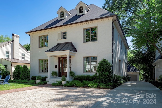 view of front of house featuring an outbuilding and a garage