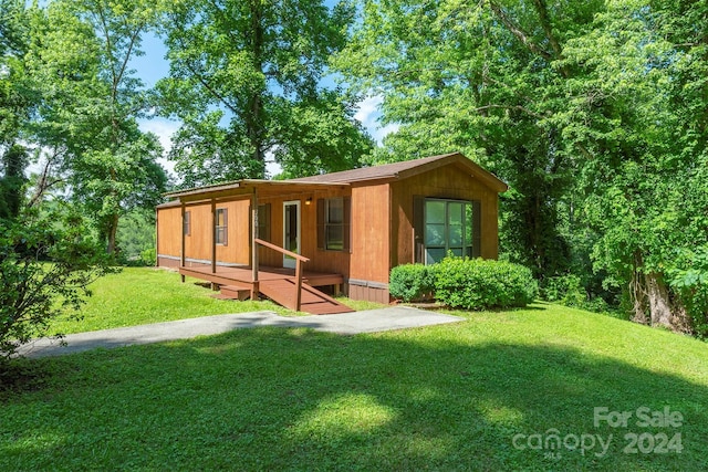 exterior space featuring a deck and a yard