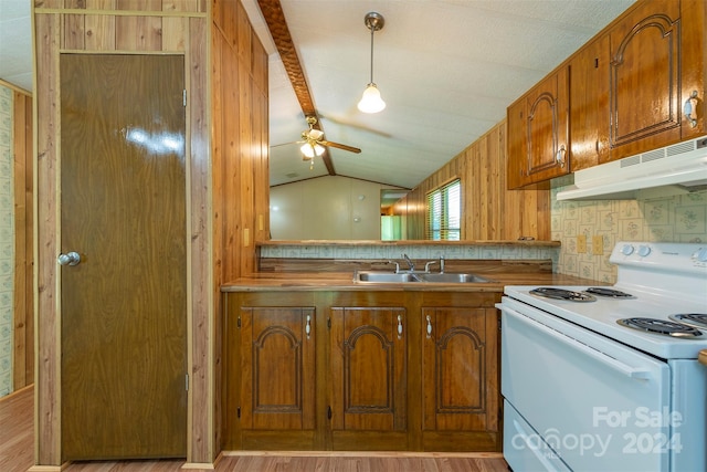 kitchen with sink, hanging light fixtures, vaulted ceiling, ceiling fan, and white electric range oven