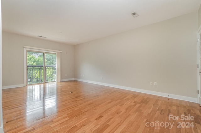 empty room with light wood-type flooring