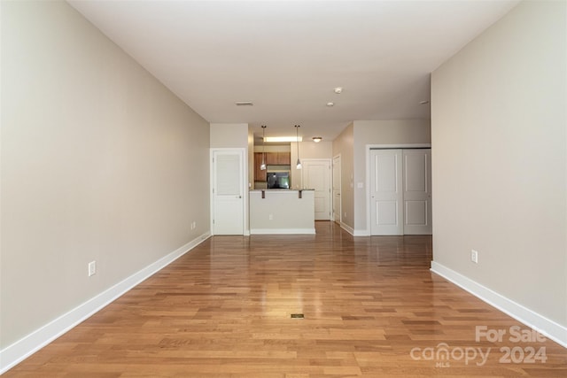 unfurnished living room with light wood-type flooring