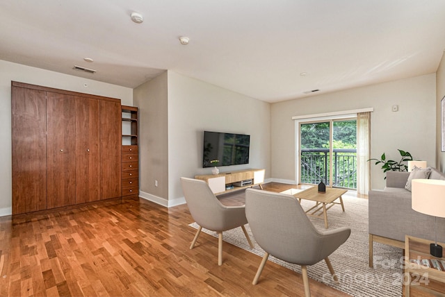 living room with light hardwood / wood-style floors