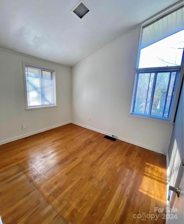 empty room with wood-type flooring