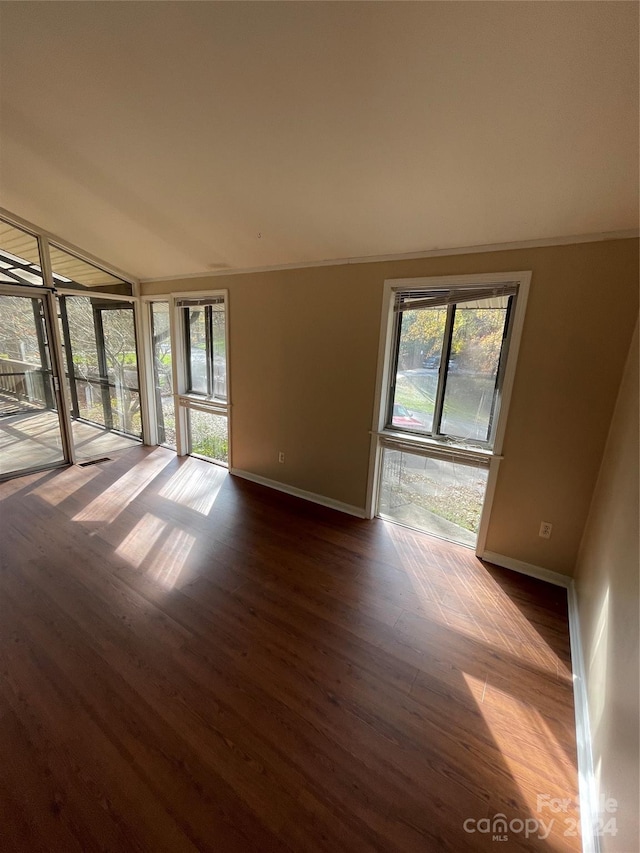 spare room with wood-type flooring and ornamental molding