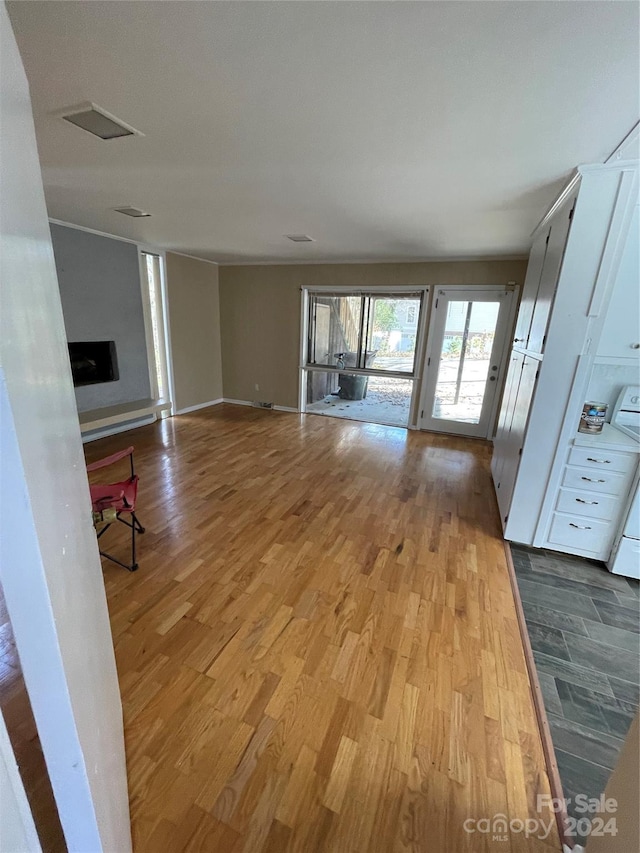 unfurnished living room featuring light hardwood / wood-style floors