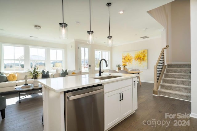 kitchen featuring plenty of natural light, white cabinets, stainless steel dishwasher, and a center island with sink