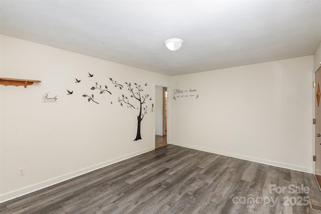 unfurnished room featuring dark hardwood / wood-style flooring