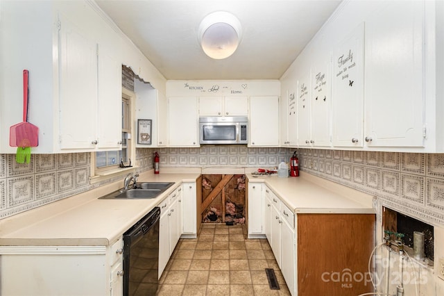 kitchen with backsplash, dishwasher, white cabinets, and sink