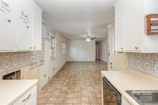 kitchen with white cabinets, dishwasher, and ceiling fan