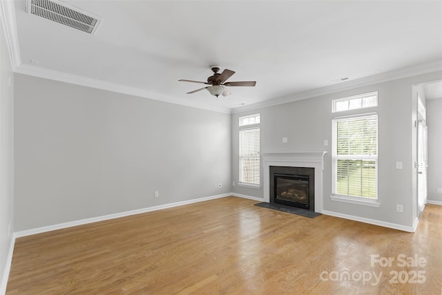 unfurnished living room featuring crown molding, ceiling fan, and light hardwood / wood-style floors