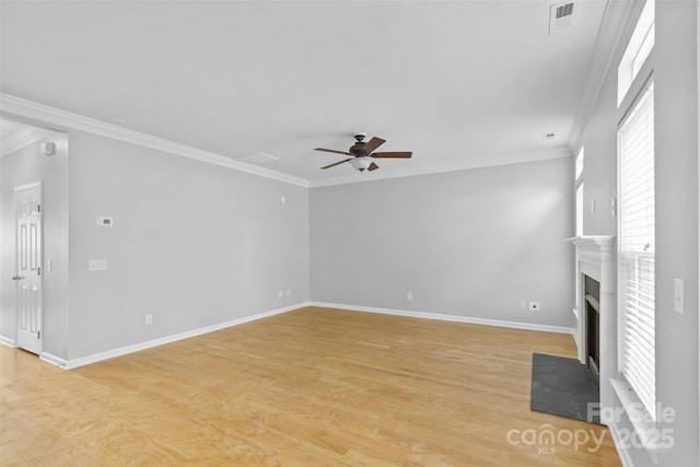 unfurnished living room with light hardwood / wood-style flooring, ceiling fan, and ornamental molding