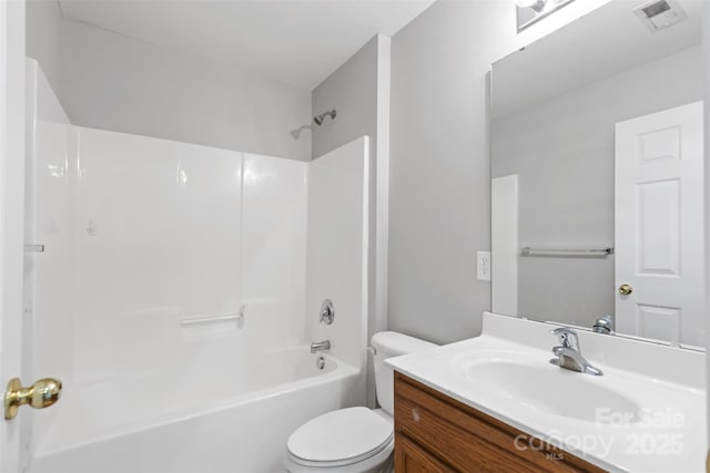 full bathroom with vanity, shower / bath combination, and toilet