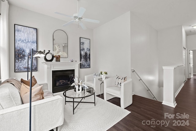 living room with ceiling fan and wood-type flooring