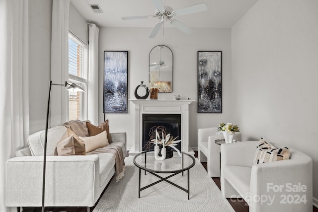 sitting room featuring ceiling fan and wood-type flooring