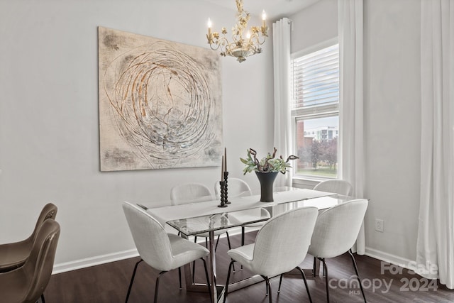 dining space featuring dark hardwood / wood-style floors and an inviting chandelier