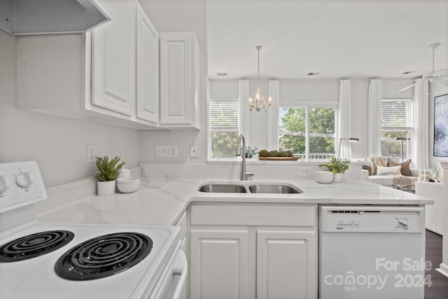 kitchen with range, white cabinetry, white dishwasher, hardwood / wood-style flooring, and sink