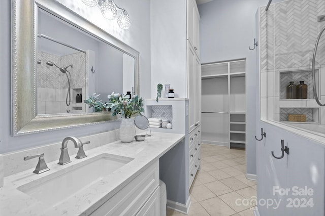 bathroom with vanity and tile patterned flooring