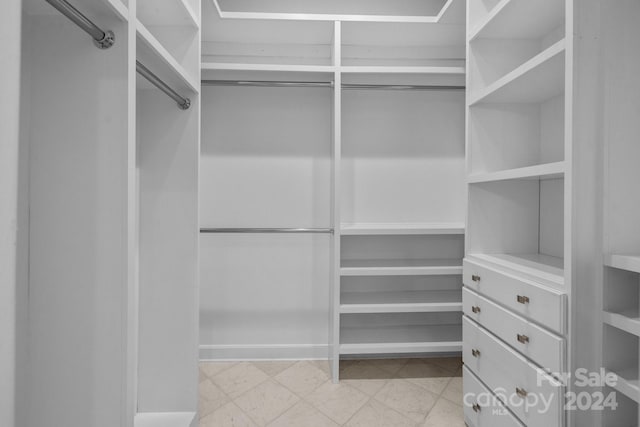 walk in closet featuring light tile patterned floors