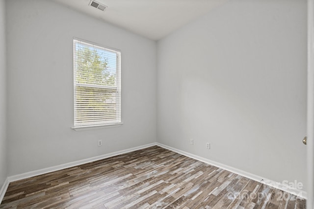 spare room featuring hardwood / wood-style floors