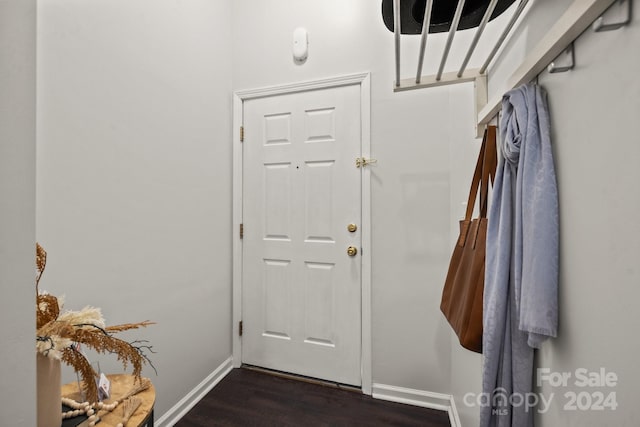 entryway with dark wood-type flooring