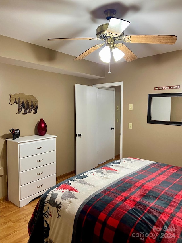 bedroom featuring ceiling fan and light hardwood / wood-style floors