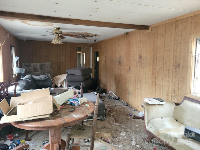 interior space featuring ceiling fan and beamed ceiling