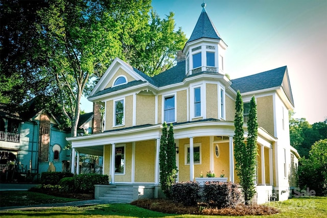 victorian-style house with a porch