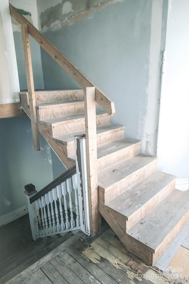 stairs with hardwood / wood-style flooring