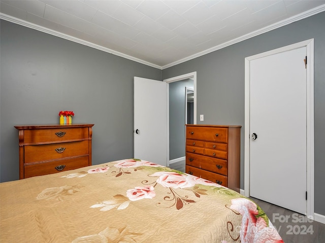 bedroom featuring crown molding