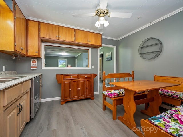 kitchen with dishwasher, sink, crown molding, ceiling fan, and light hardwood / wood-style floors