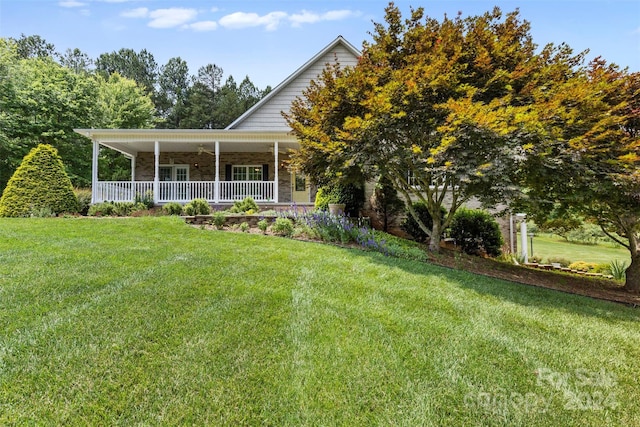 view of front of property with a front yard and covered porch